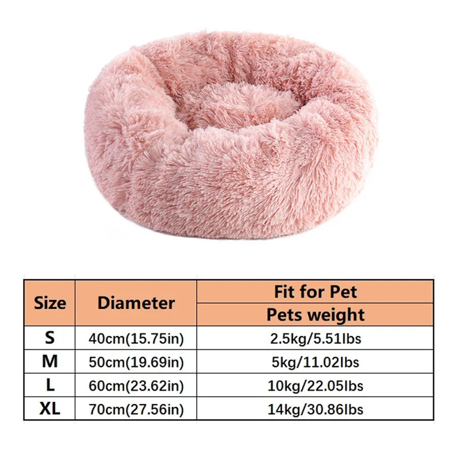Calming donut dog bed in pink — long plush faux fur round cuddler with raised rim