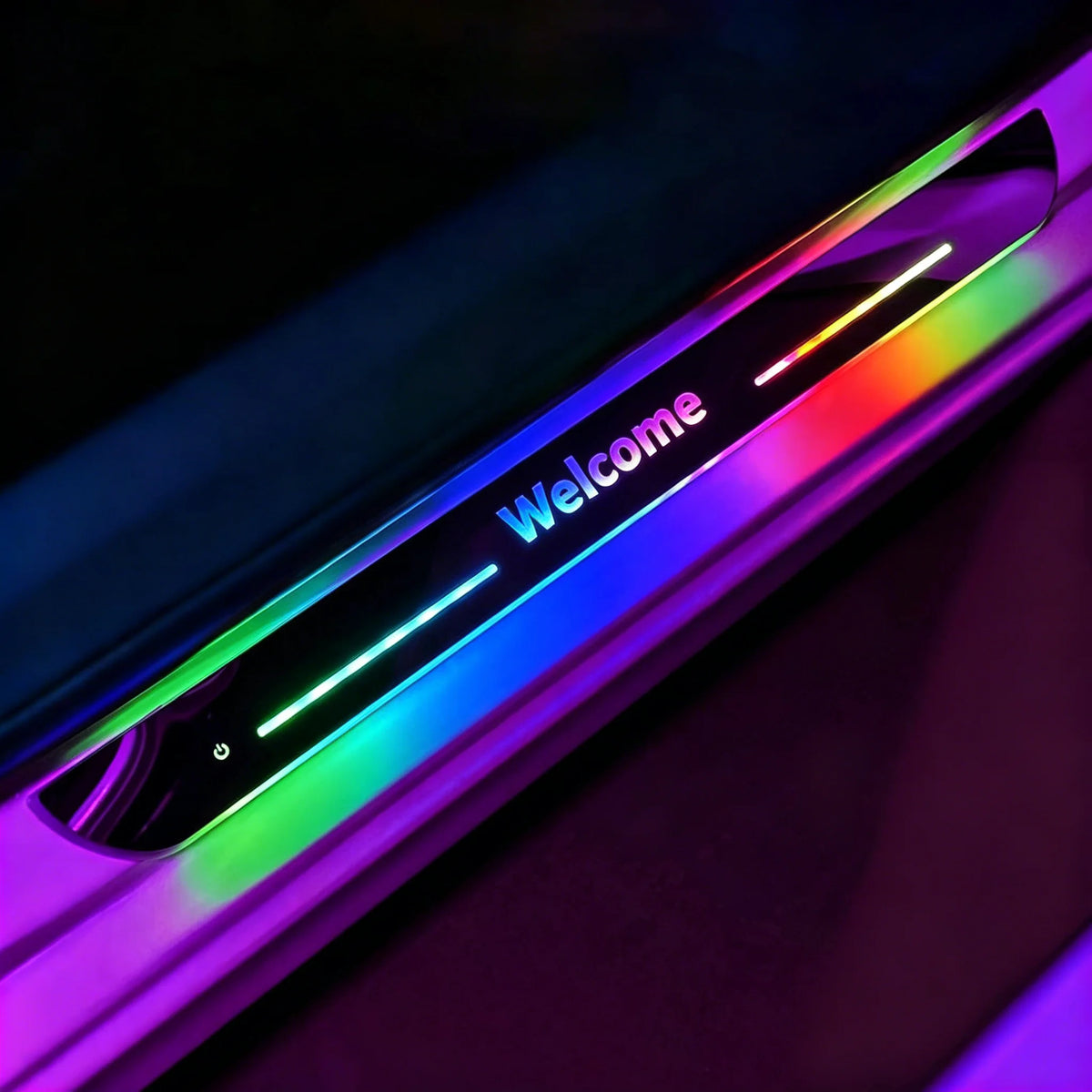 Custom text LED car door sill plate lit up in rainbow colors, showing the word Welcome